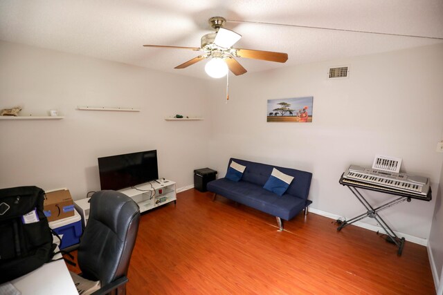 home office featuring ceiling fan and wood-type flooring