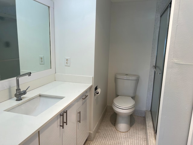 bathroom featuring vanity, toilet, and tile patterned flooring