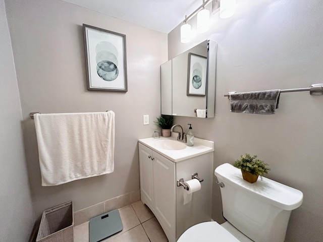 bathroom with vanity, tile patterned floors, and toilet