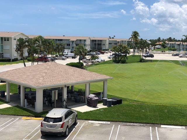320 Horizons W Unit 103, Boynton Beach, FL 33435 - view of home's community with uncovered parking, a gazebo, and a yard