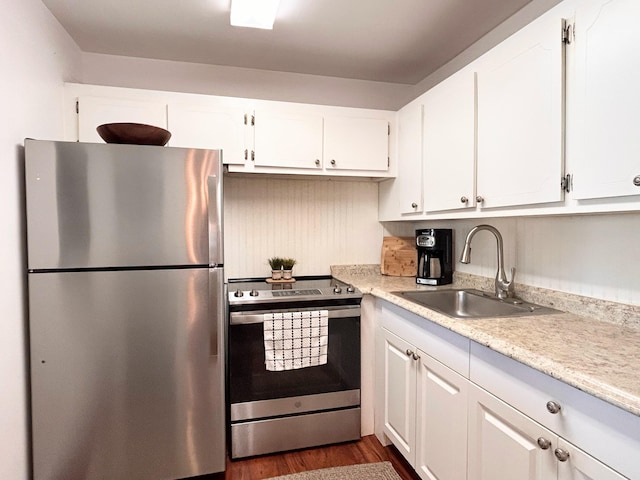 320 Horizons W Unit 103, Boynton Beach, FL 33435 - kitchen with appliances with stainless steel finishes, a sink, light countertops, and white cabinets