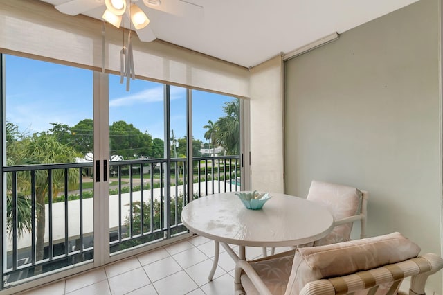 sunroom featuring a healthy amount of sunlight and ceiling fan