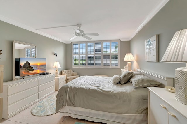 bedroom featuring ceiling fan, light tile patterned floors, and ornamental molding