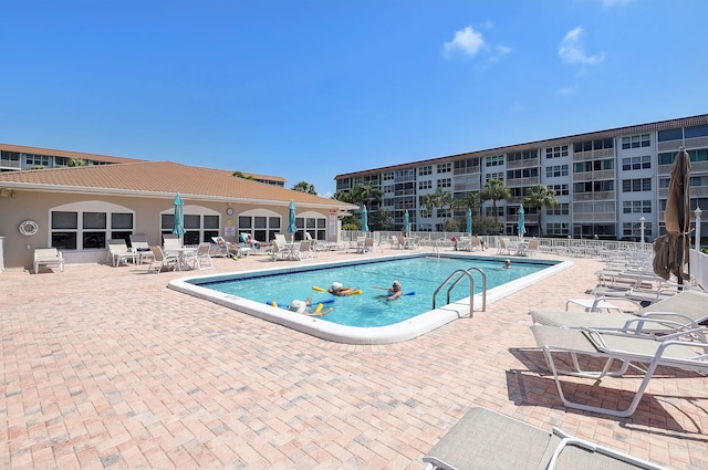 view of swimming pool featuring a patio area