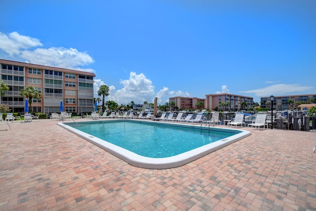 view of swimming pool featuring a patio area