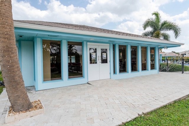 back of property with a patio and french doors