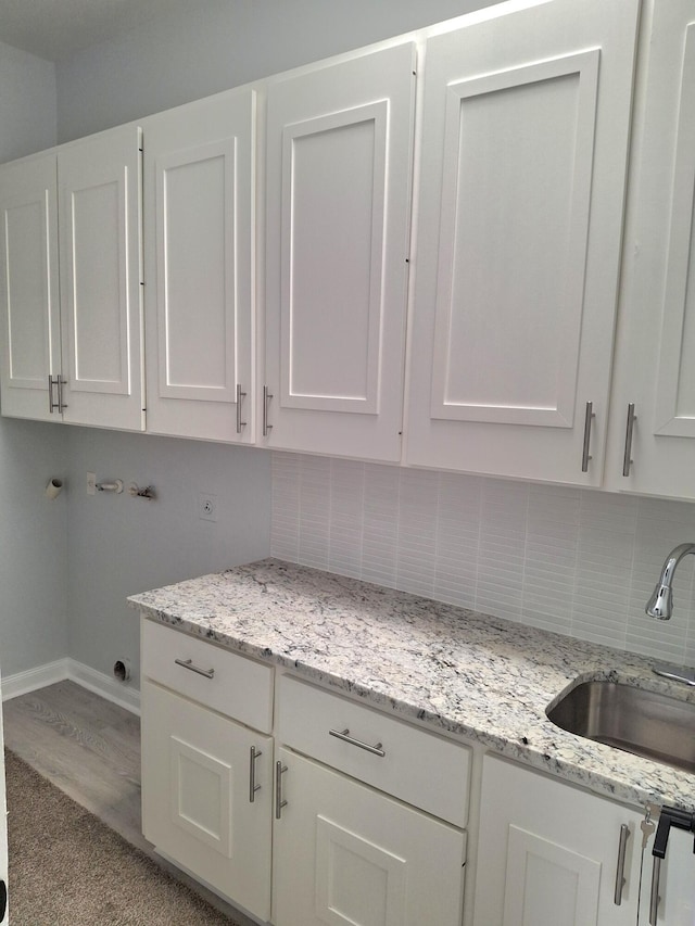 7504 SE Marsh Fern Ln, Hobe Sound, FL 33455 - laundry room with cabinet space and washer hookup