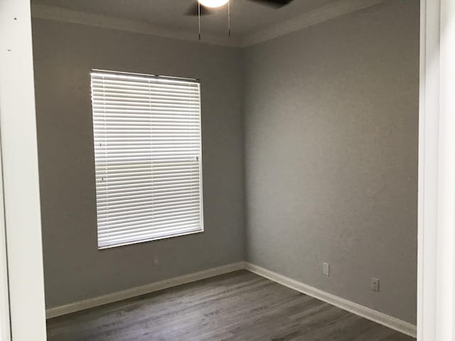 7504 SE Marsh Fern Ln, Hobe Sound, FL 33455 - empty room featuring ceiling fan, ornamental molding, dark wood-type flooring, and baseboards