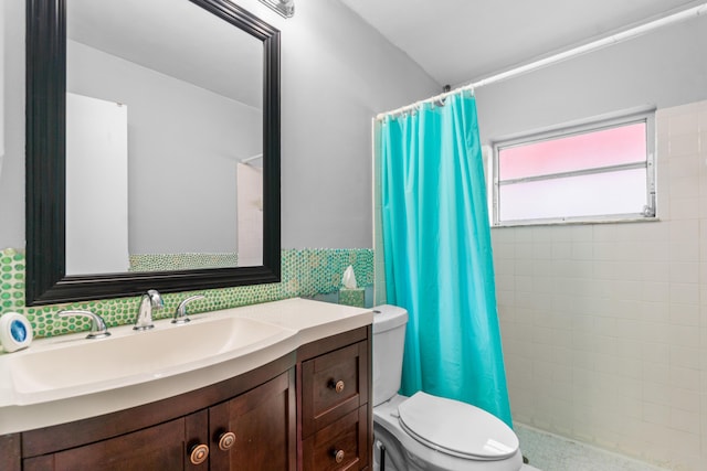 bathroom with vanity, toilet, and curtained shower