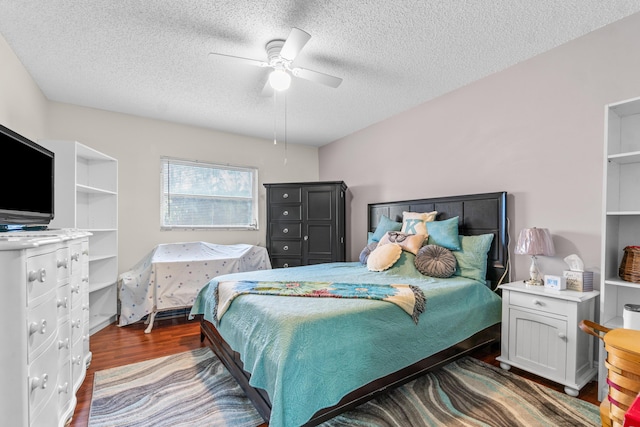 bedroom featuring a textured ceiling, dark hardwood / wood-style floors, and ceiling fan