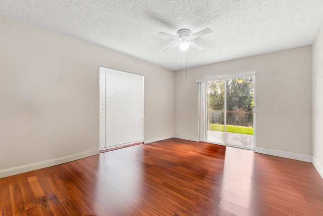 unfurnished room featuring hardwood / wood-style floors and a textured ceiling