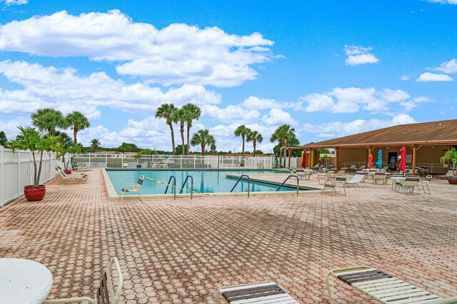 view of swimming pool featuring a patio area