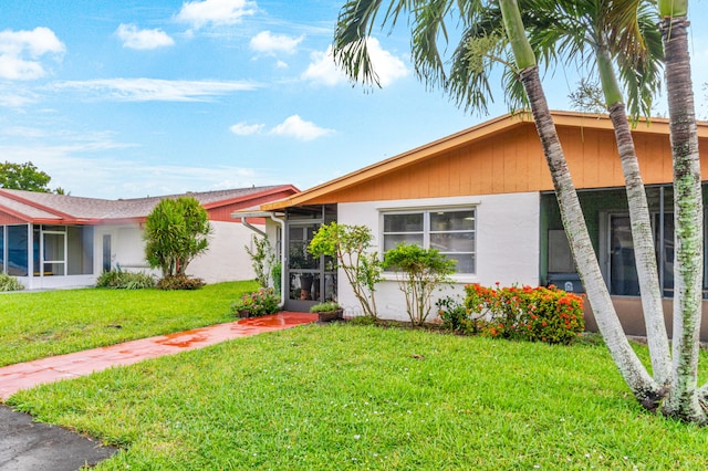 view of front of home with a front lawn