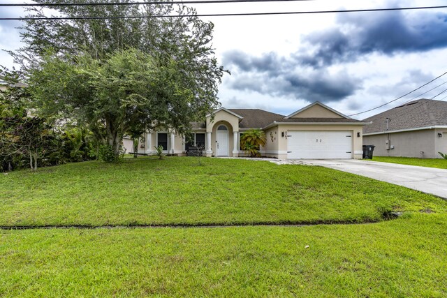 single story home with a garage and a front yard