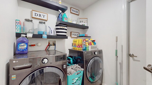 clothes washing area featuring washing machine and dryer