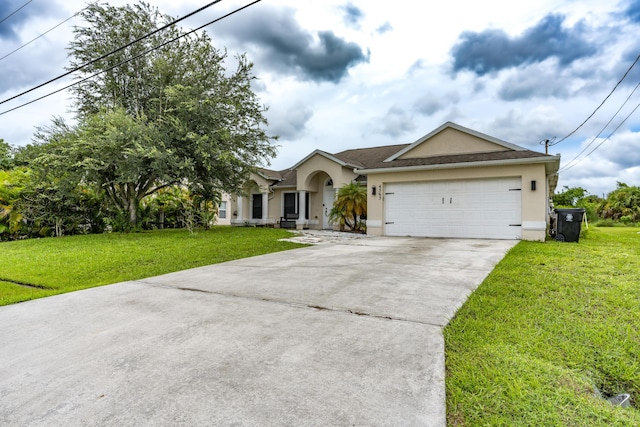 single story home featuring a garage, driveway, a front lawn, and stucco siding