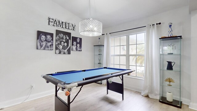 game room featuring pool table, baseboards, and wood finished floors