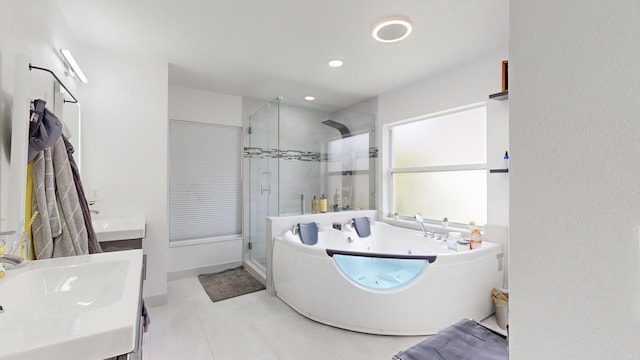 full bathroom featuring a bath, a shower stall, vanity, and recessed lighting