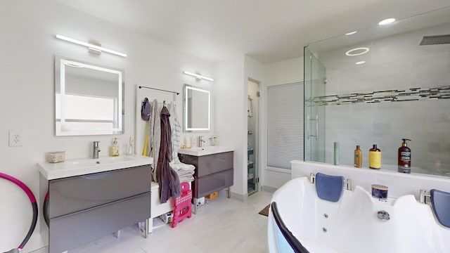 full bath with recessed lighting, visible vents, two vanities, a sink, and a shower stall