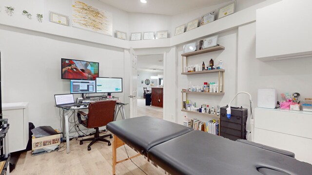 office space with light wood-type flooring