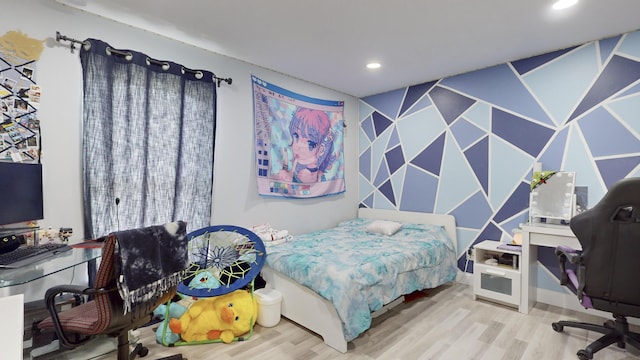 bedroom featuring wood finished floors and recessed lighting