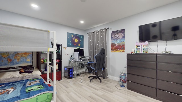 bedroom with baseboards, recessed lighting, and light wood-style floors