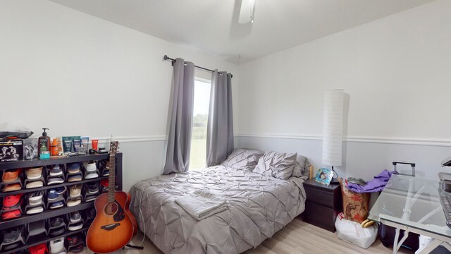 bedroom featuring light hardwood / wood-style flooring and ceiling fan