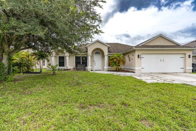 ranch-style house with a garage and a front lawn