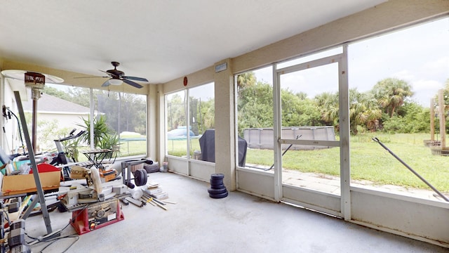 sunroom with a ceiling fan