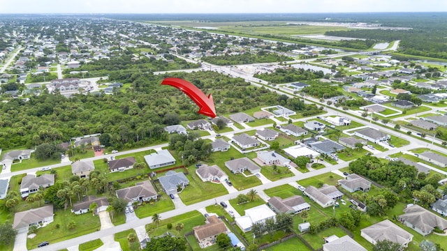 birds eye view of property with a residential view