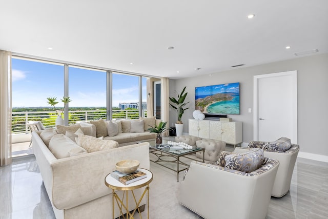 living room featuring a wall of windows