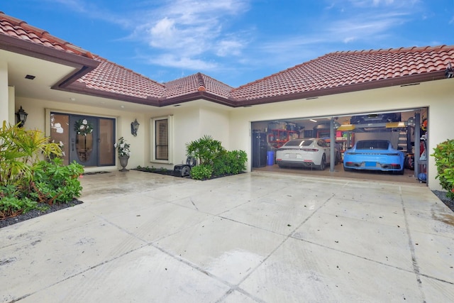 mediterranean / spanish house with a garage