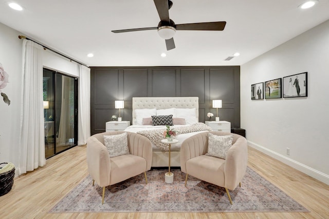 bedroom featuring ceiling fan and light hardwood / wood-style floors