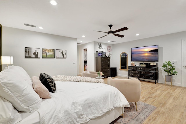 bedroom featuring light hardwood / wood-style floors and ceiling fan