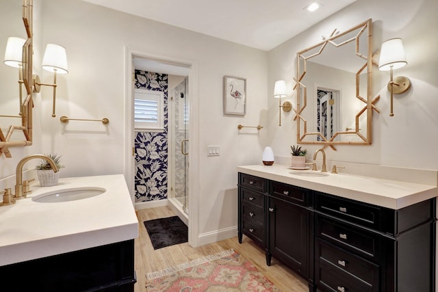 bathroom featuring vanity, hardwood / wood-style flooring, and walk in shower