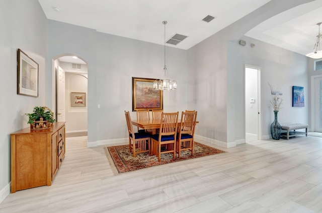 dining room with a notable chandelier