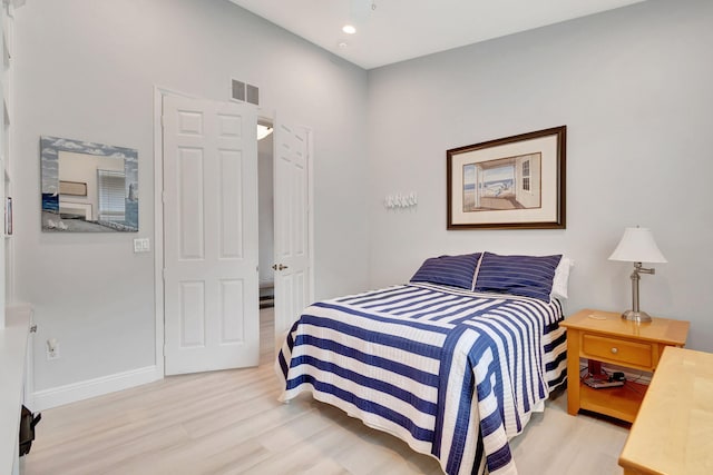 bedroom with light hardwood / wood-style floors