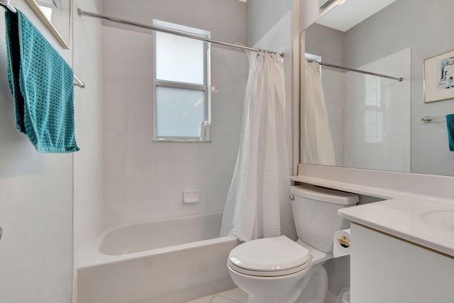 full bathroom featuring tile patterned flooring, vanity, toilet, and shower / tub combo with curtain