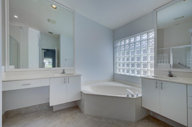 bathroom featuring vanity, separate shower and tub, and plenty of natural light