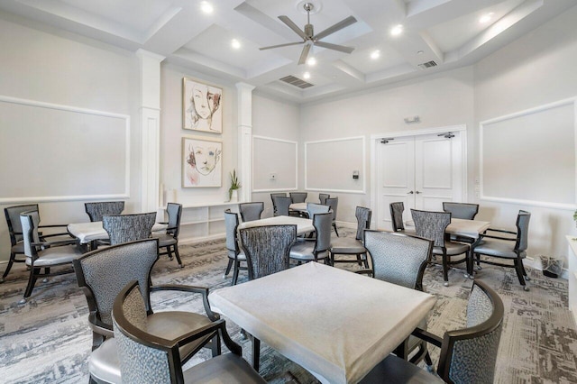 interior space featuring beamed ceiling, coffered ceiling, a towering ceiling, and ceiling fan