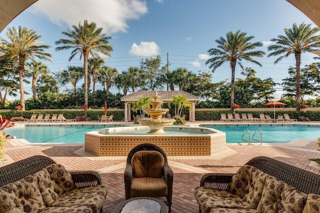 view of swimming pool featuring a patio area