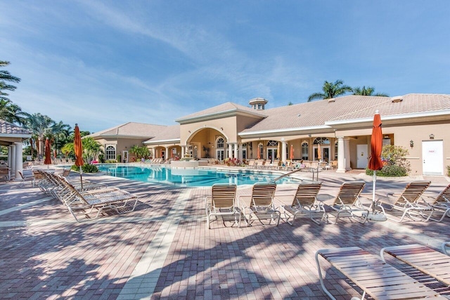 view of swimming pool with a patio area