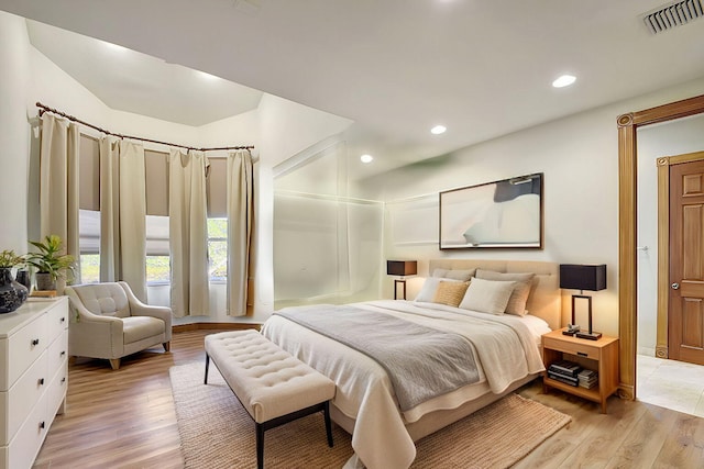 bedroom with light hardwood / wood-style flooring