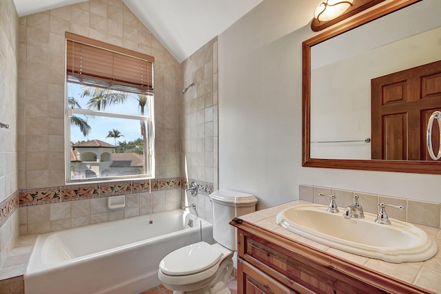 bathroom featuring vanity, lofted ceiling, and toilet