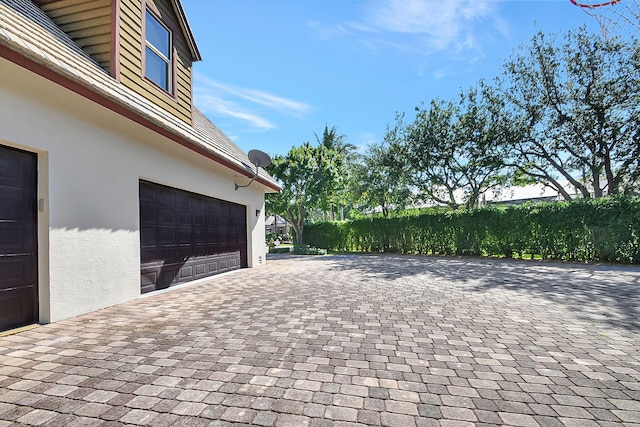 view of patio featuring a garage