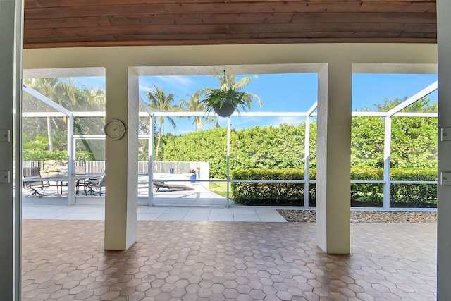 doorway to outside featuring wooden ceiling