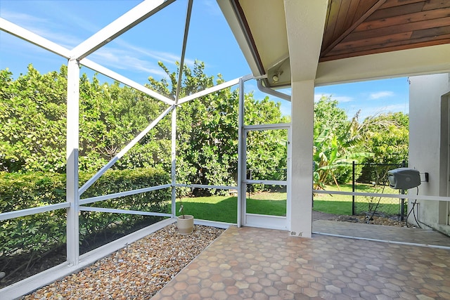 unfurnished sunroom featuring a wealth of natural light