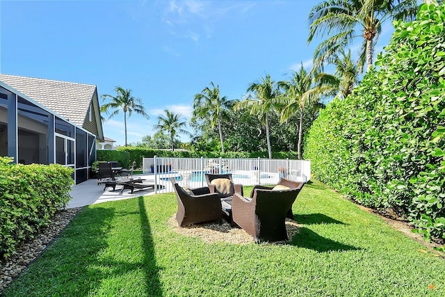 view of yard with a fenced in pool, a patio area, and a lanai