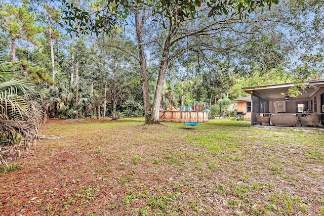 view of yard featuring a sunroom