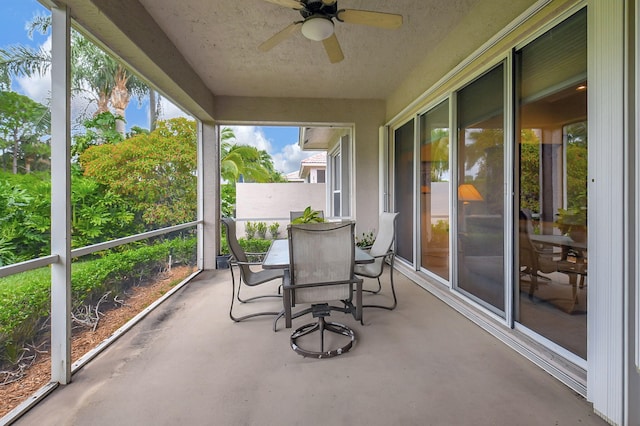 sunroom featuring ceiling fan